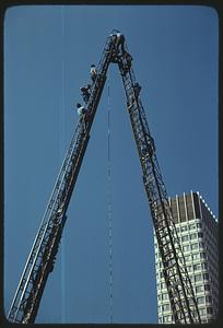 People, probably firemen, on an aerial ladder, Boston City Hall Plaza