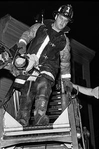 Firefighter Billy Abramofsky coming down the ladder