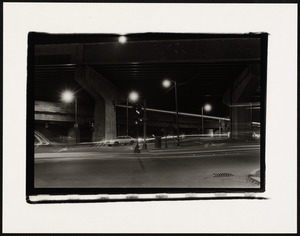 Underneath the elevated tracks at night