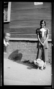Constance Miller stands with a dog