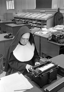 Nun working in city room, Standard-Times newspaper, Pleasant Street, New Bedford