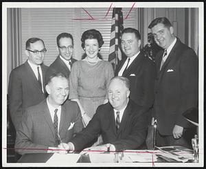 is signed by Mayor Collins. Maurice J. Downey, Boston School Dept., and Mayor Collins: Standing: Joseph Lapidus and Dr. Anthony Abruzzese of Boston School Creech, United Community Services; William Casey, Randolph School Dept.