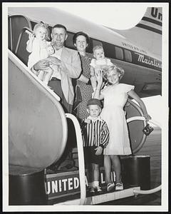 Golfer's Family Flies to Iowa City, Ia., for visit with wife's parents. Mr. and Mrs. Harold Sjostedt of North Weymouth, with Ann, 1, nephew Jon, 1, Janice, 11, and William, 4, board United Air Lines' Mainliner at Boston for the western city. Sjostedt was this year's captain of the South Shore Country Club four-ball team. Gov. Stevenson To Start Aug. 27