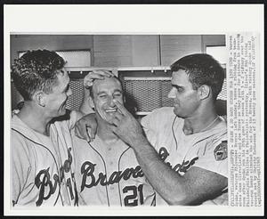 Philadelphia - Spahn a 20 Game Winner For 13th Time – Warren Spahn, veteran Milwaukee Braves left hander, takes a ribbing from teammates Gene Oliver (left) and Joe Torre as they pose for picture in dressing room after Spahn won his 20th game of season with 3-2 victory over the Philadelphia Phillies in Philadelphia yesterday. Oliver’s 8th inning two-run homer clinched the win for the Braves. With victory Spahn tied record set by Christy Mathewson of 13 twenty game seasons.