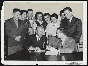 Their Voices Carried to Europe - Employes of Raytheon Manufacturing Company who will appear tonight on Stadion WRUL's Voice of Freedom program to describe life in American industrial plants to foreign countries behind the Iron Curtain. Left to right seated: Charles Francis Adams, Jr., president, Raytheon Company, and Sid Diamond, WRUL announcer. Standing are Y.S. Kim, South Korea; Consuela Morgan, secretary, Local 1505 IBEW; R. Gray, E. Bicchieri, O. D. Attillio; P.L. Spencer. Two women next to Gray are not named to prevent harm to relatives in Lithuania and Estonia.