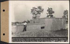 Contract No. 105, Lightning Protection for Buildings, Barre, Belchertown, Hardwick, Marlborough, Rutland, Southborough, Weston, West Boylston, looking easterly at chlorine storage building at Norumbega Reservoir showing general view of air terminals and down cables, Weston, Mass., Jul. 11, 1941