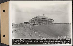 Contract No. 80, High Level Distribution Reservoir, Weston, looking west from Sta. 893+50+/- showing slate roof on the east side of the gatehouse, high level distribution reservoir, Weston, Mass., Jul. 23, 1940