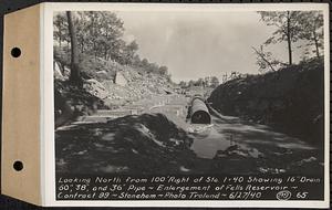 Contract No. 99, Enlargement of Fells High Level Distribution Reservoir, Stoneham, Malden, Melrose, looking north from 100 feet right of Sta. 1+40 showing 16 inch drain, 60 inch, 38 inch, and 36 inch pipe, enlargement of Fells Reservoir, Stoneham, Mass., Jun. 27, 1940