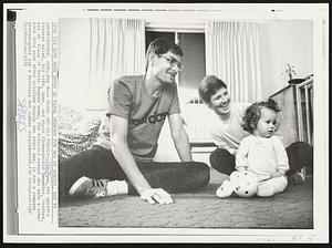 A Champ and his Family-- Jim Ryun, the world's fastest miler, his wife, Anne, and their 10-month-old daughter, Heather, sit on floor of their Eugene home. The 6-foot-3 runner who made a comeback this year after quitting nearly two years ago, is now a company photographer for a building and lumber conglomerate.