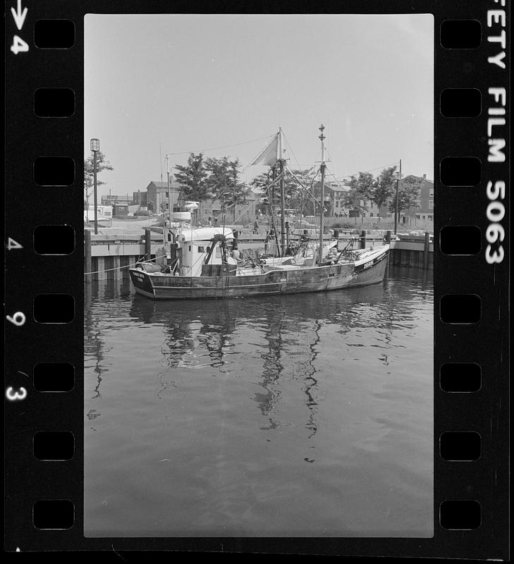 Boat docked at pier