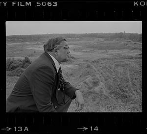 Peter Matthews looking at vacant lot