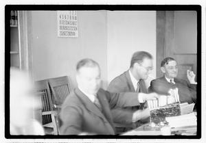 Group of men at table