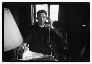 A priest on a phone call