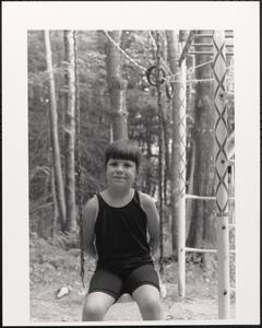 Child sitting on a swing
