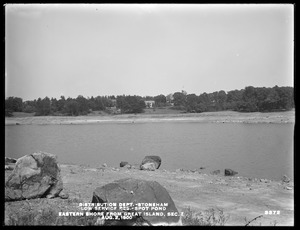 Distribution Department, Low Service Spot Pond Reservoir, eastern shore, Section 7, from Great Island. Buildings in background, Stoneham, Mass., Aug. 2, 1900