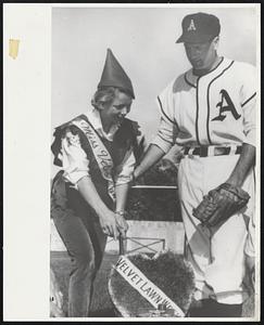 Spring Training Valentine. West Palm Beach, Florida. First of the Kansas City Athletics to arrive at Connie Mack Field for spring training, Pitcher Art Ditmar awards a grass valentine to Patte Preble, who reigns as Miss Velvet Lawn. The Queen and her court mowed centerfield grass to open the A’s spring training season as part of Power Products’ Velvet Lawn Week, Feb. 10-16.