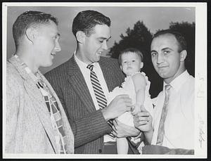 Braves’ Trio has few refreshing moments with nine-month-old Patricia Ann Kelly while idling away daylight hours before game with Red Sox. Left to right are Don McMahon, Gene Conley and Frank Torre. Conley, former basketball player with Celts, played with Pat’s father in minor league.