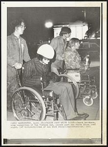 Parade Past White House--Peace marchers, some casualties of the Vietnam war, parade past the White House last night.