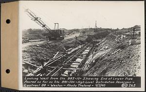 Contract No. 80, High Level Distribution Reservoir, Weston, looking west from Sta. 883+10+/- showing end of lower pipe poured as far as Sta. 881+50+/-, high level distribution reservoir, Weston, Mass., Apr. 2, 1940