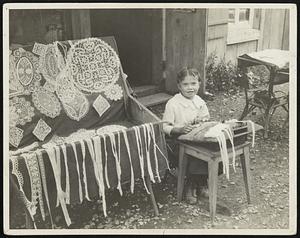 Sales Ladies. This very young dealer in fine laces, at Murren village, Switzerland, is a manufacturer also. The child labor laws of Switzerland are not severe, it would seem.