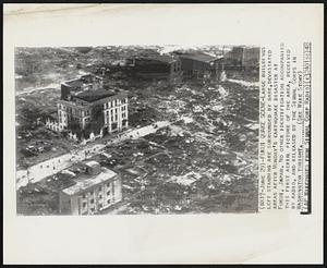 Fukui Quake Scene- Large buildings left standing are surrounded by bare, devastated areas after Monday's earthquake disaster at Fukui, Japan. No other identification accompanied this first aerial picture of the area, received by radio, and released by the Signal Corps in Washington tonight.