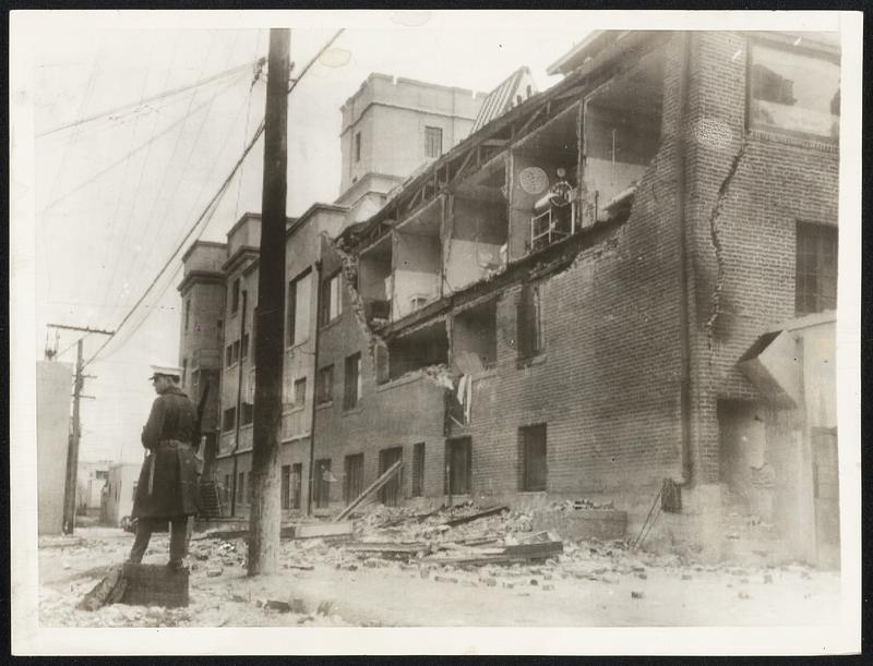 Long Beach Hospital Damaged -- Wing of the Seaside Hospital, Long Beach, Calif., After the Earthquake. Not Long After the Wall Fell, a Baby Girl Was Born and a Delicate Operation Was Performed by Hospital Surgeons. Long Beach Was the Worst Sufferer in the Quake - About 67 of Its Citizens Were Killed. This Picture Was Telephotoed to New York From Los Angeles.