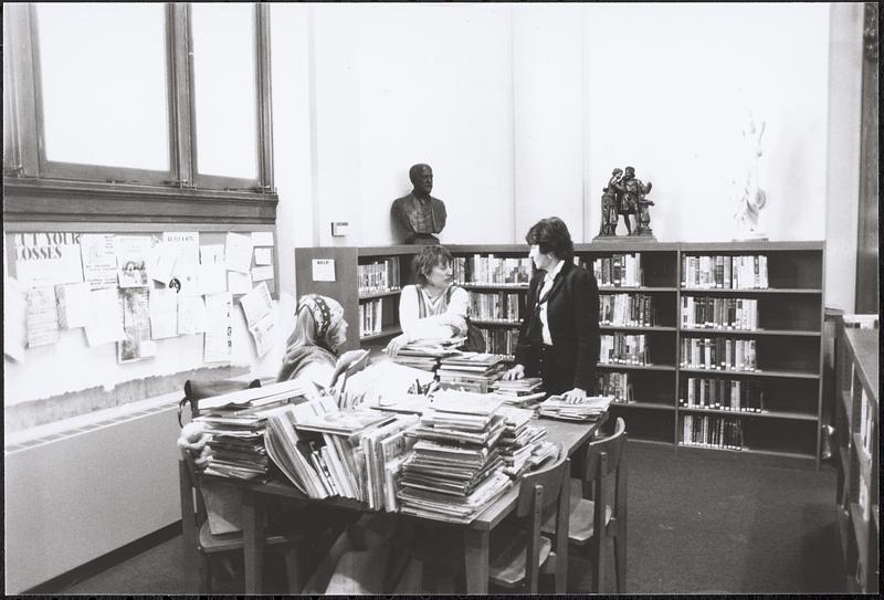 Three women in Lawrence Library