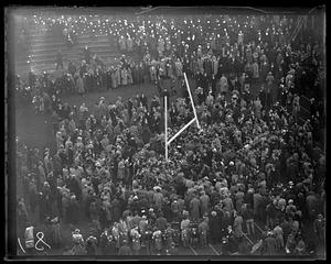 Crowd gathers, around goalposts after Harvard - Holy Cross game