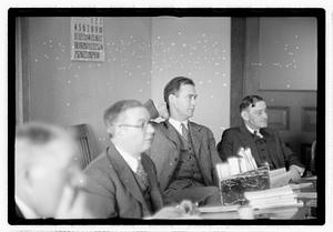 Group of men at table