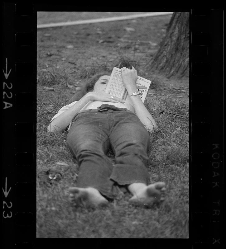 Summer reading on Charles River embankment, Boston