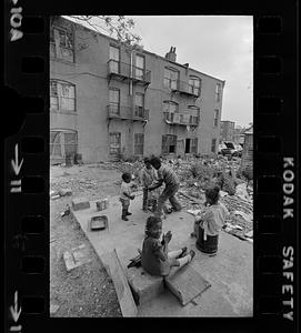 Overcrowded, black-owned, inner-city slum tenement