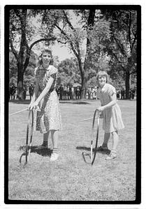 Girls rolling hoops