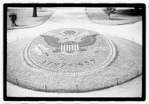 "1787-1937" floral design of the Great Seal of the United States in front of Ether Monument, Public Garden