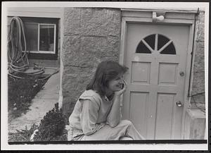 Woman sitting and smiling