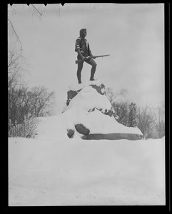 Minuteman statue covered with snow