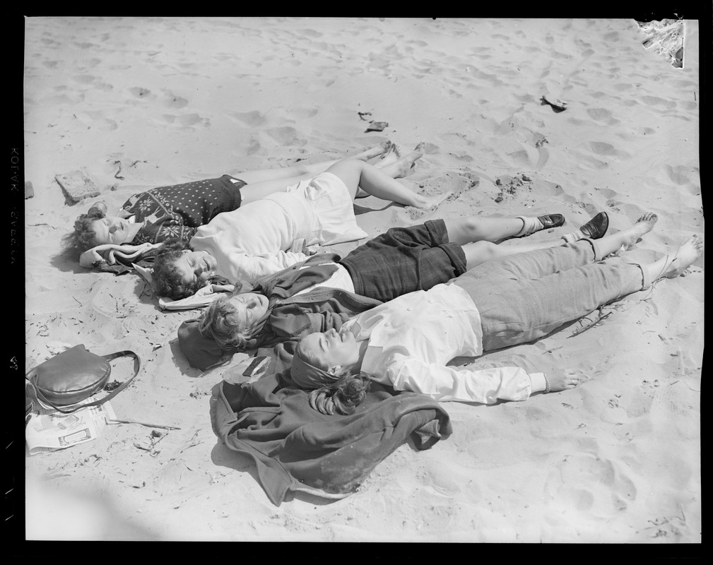 Girls lying down at the beach