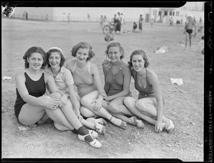 Women pose on the beach