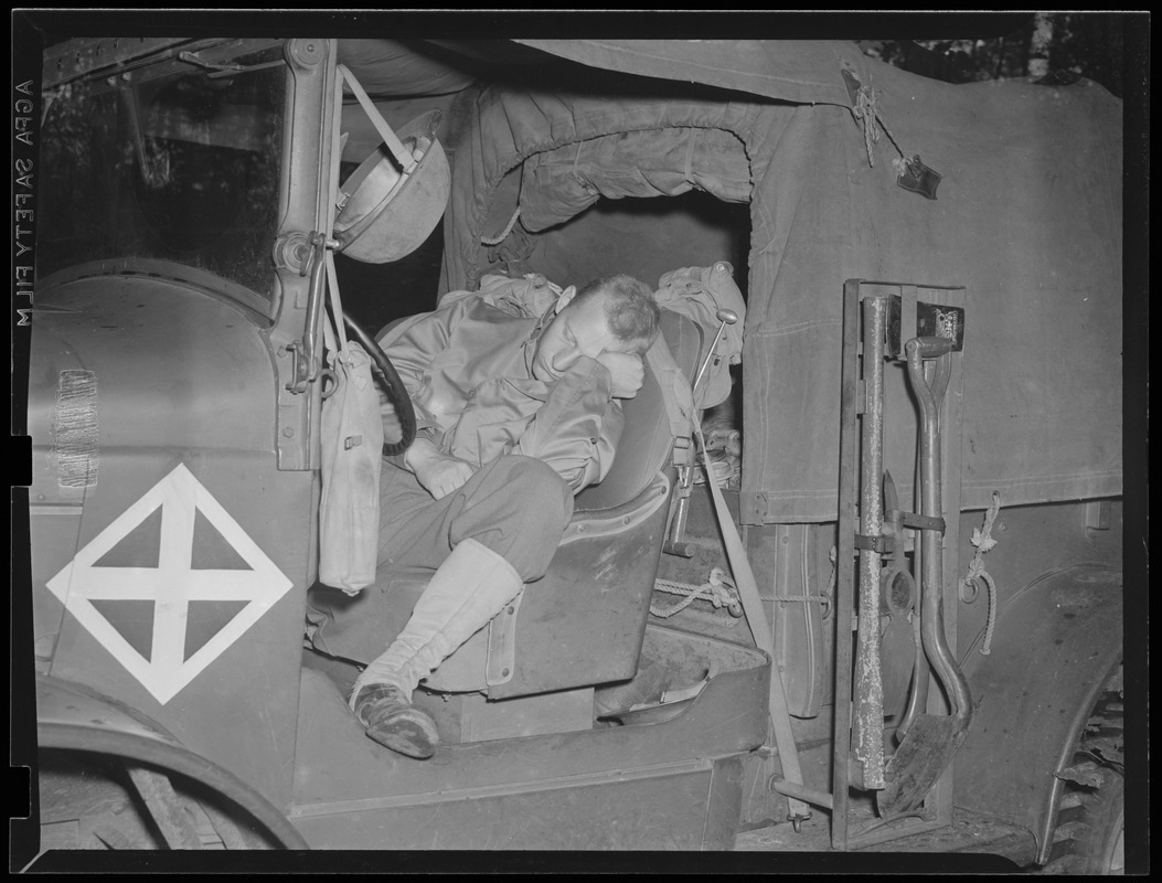 Soldier sleeping in truck