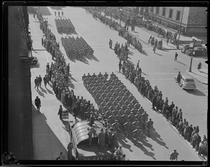 Military parade past Boston Public Library