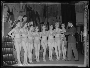 Soldier and showgirls backstage