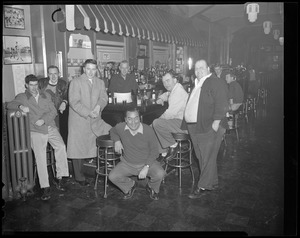 Men posed in bar