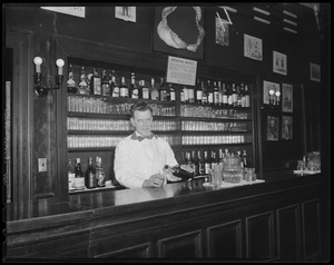 Bartender stationed under shark's jaw