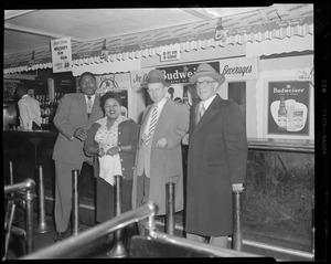 Three patrons at Handy Café with African-American man