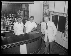 Man with two bartenders