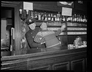 Cop pretends to arrest bartender at bar with shark jaw