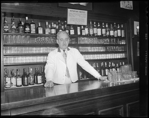 Bartenders at bar with shark jaw