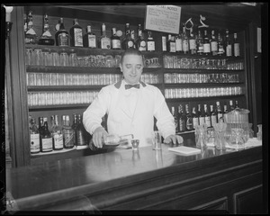 Bartenders at bar with shark jaw