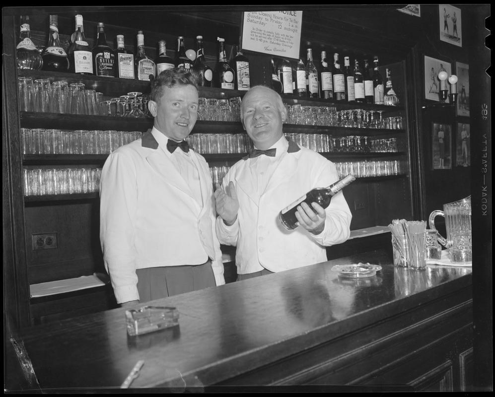 Bartenders at bar with shark jaw