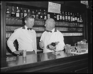 Bartenders at bar with shark jaw