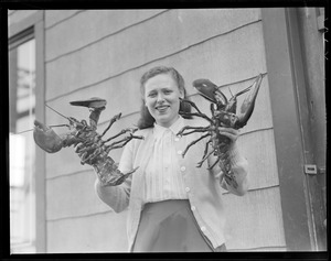 Girl holding lobsters